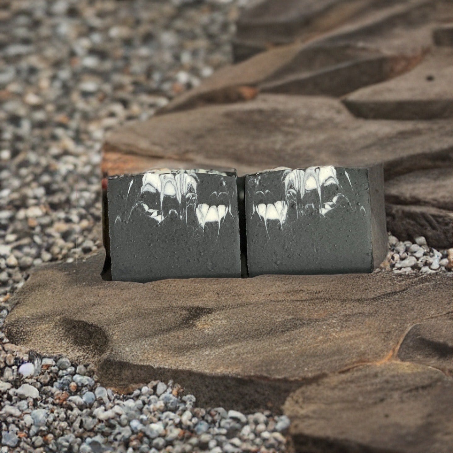 Vegan Mechanic Gardener Soap displayed on natural stone, showcasing its all-natural ingredients and unique design.