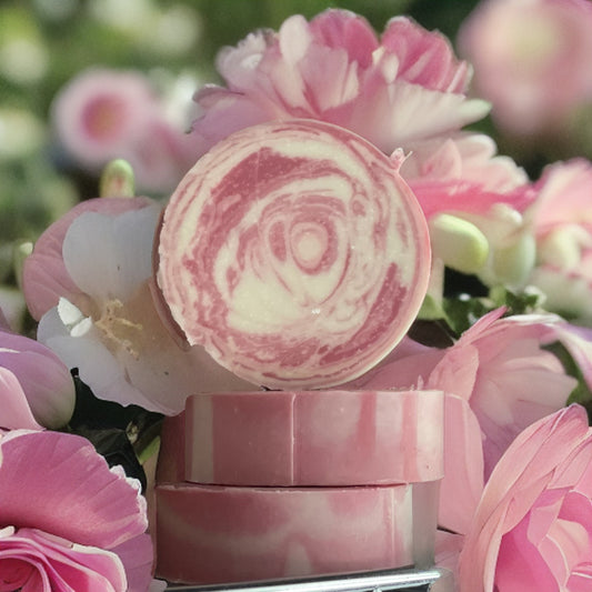 Natural shampoo bars surrounded by colorful flowers for healthier hair care.