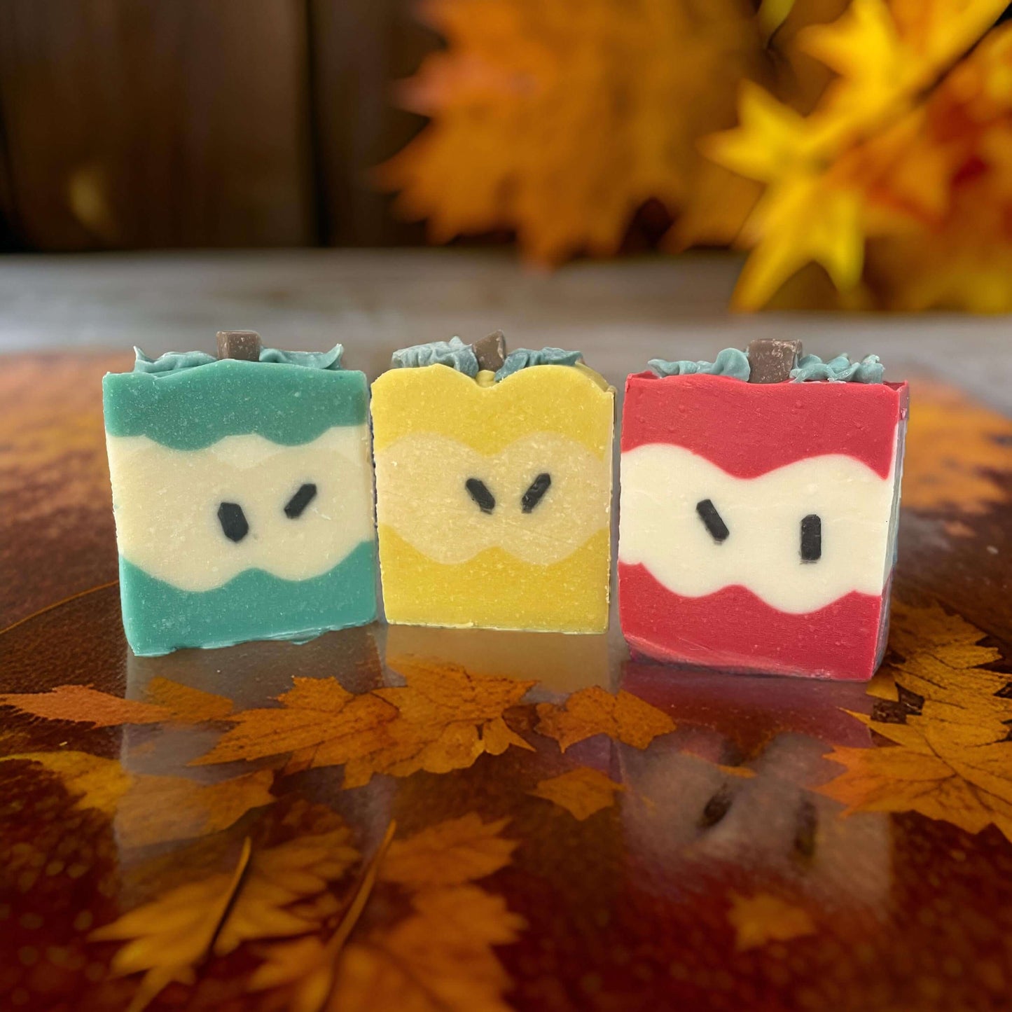 Colorful vegan soaps shaped like apples, perfect for teacher appreciation gifts.