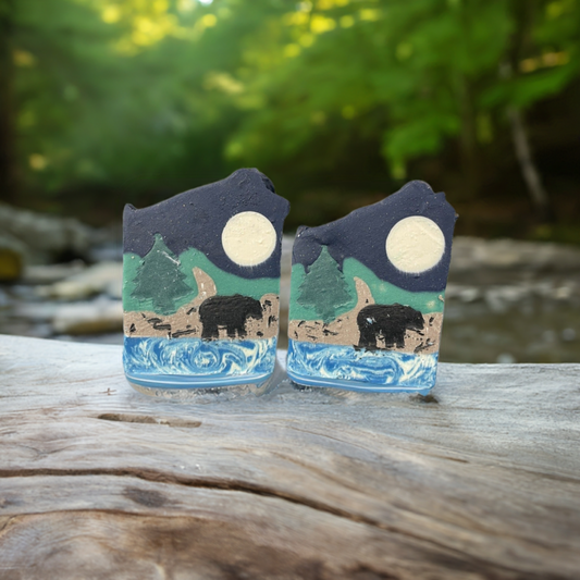 Bear Necessities artisan soap bar featuring a scenic wilderness design with a bear, moon, and trees.