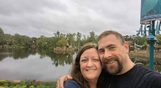 Hi Ya'll greetings from Hickory Hollow a scenic lakeside with a couple enjoying a moment together.