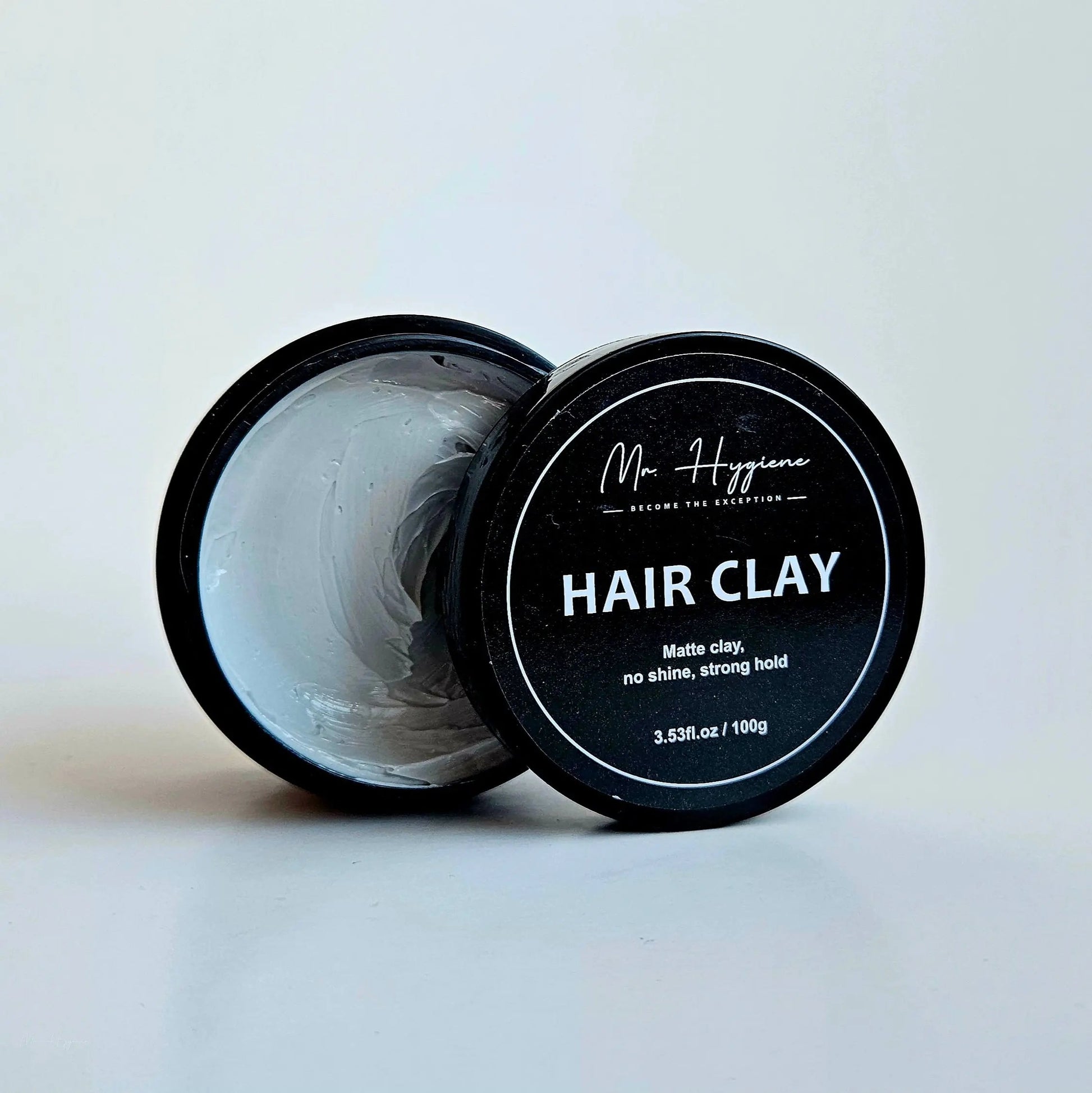 Matte Finish Hair Clay container showing strong hold and natural look for textured hairstyles.