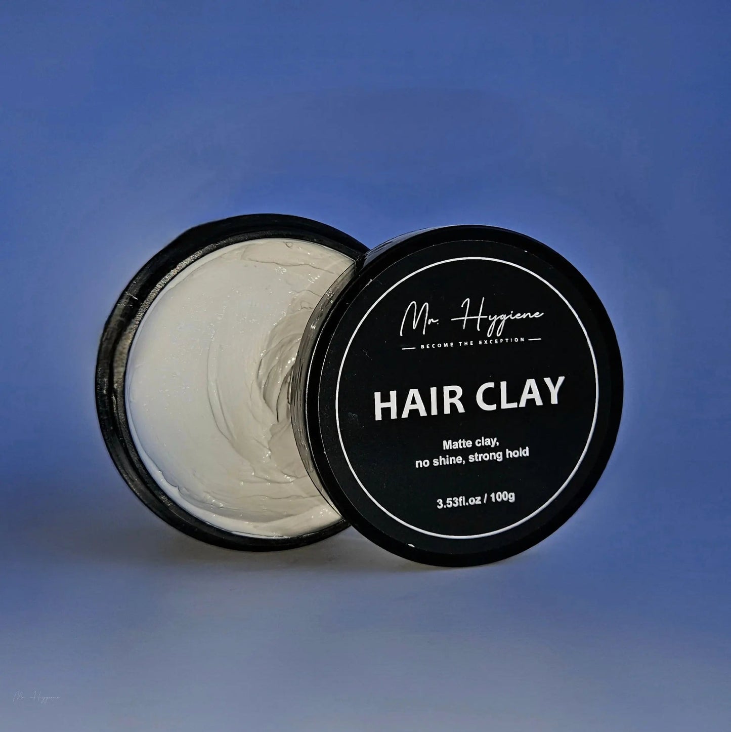 Matte Finish Hair Clay in a black container, showcasing strong hold and natural look without shine.