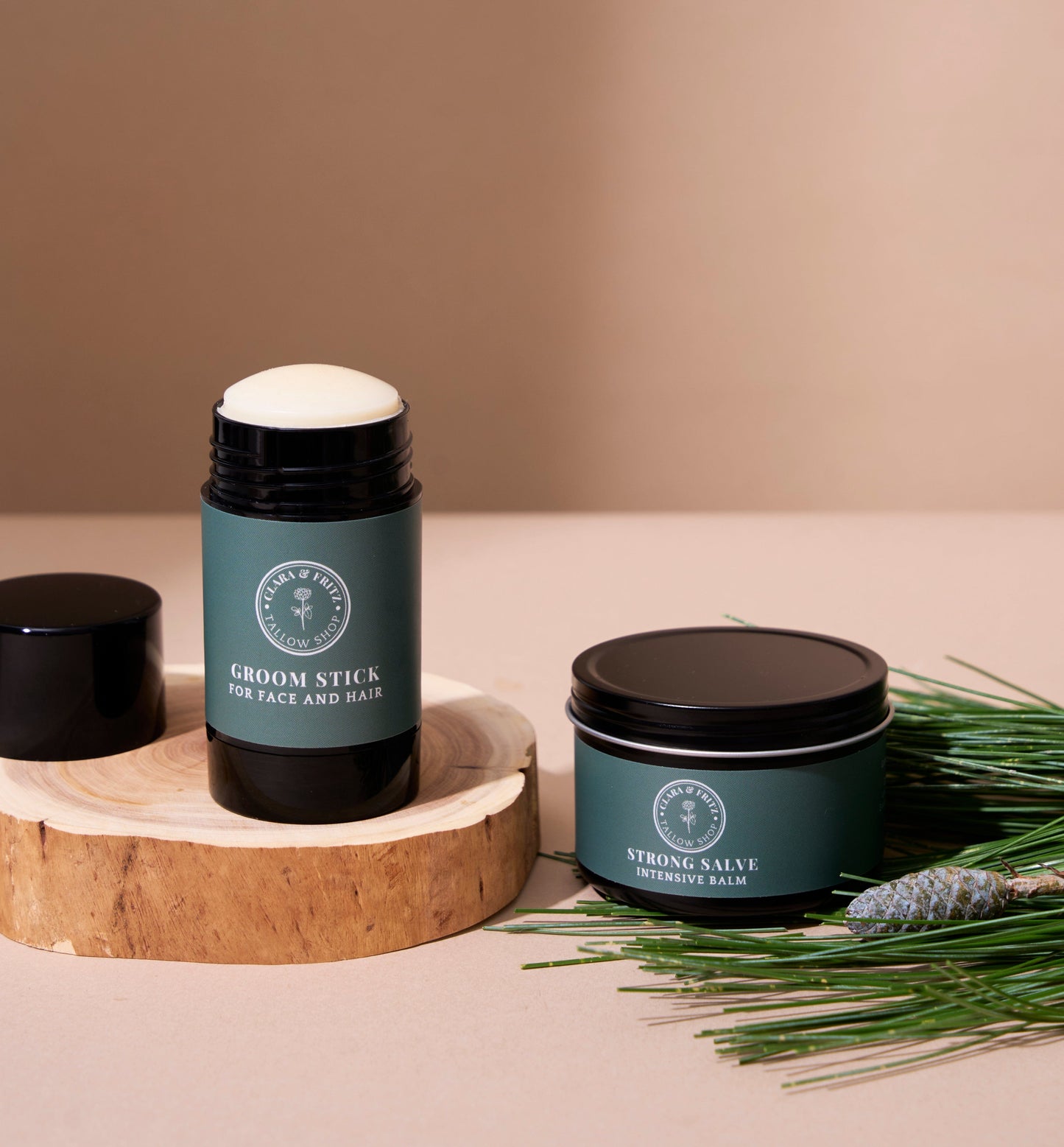 Strong Salve and Groom Stick for facial and hair care on wooden surface with greenery.
